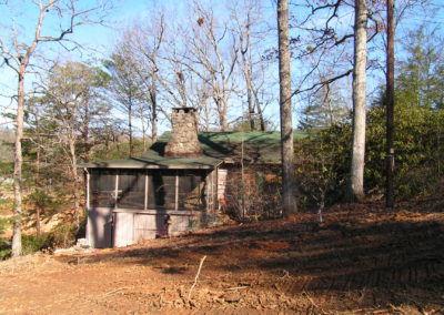 A dilapidated cabin in the middle of Georgia woods landscape