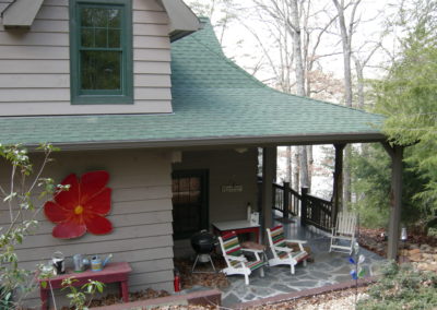 Patio view of remodeled cabin in woods