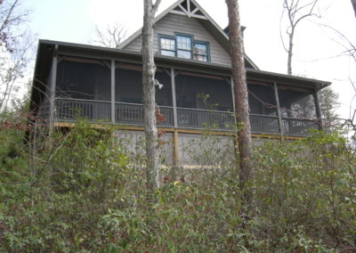 Remodeled cabin with screened porch and second story addition