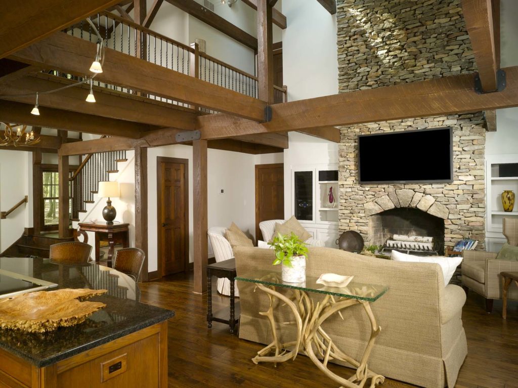 Wood-burning fireplace in lodge with post and beam construction