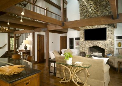 Wood-burning fireplace in lodge with post and beam construction
